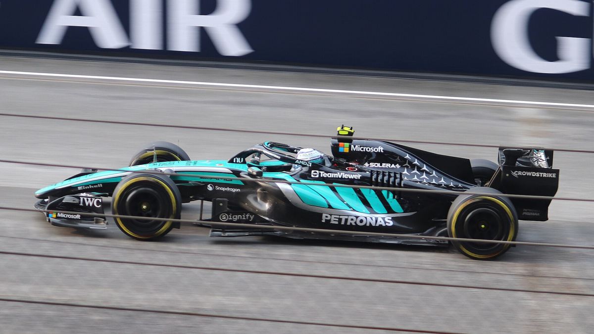 Kimi Antonelli in Mercedes team kit in the paddock.