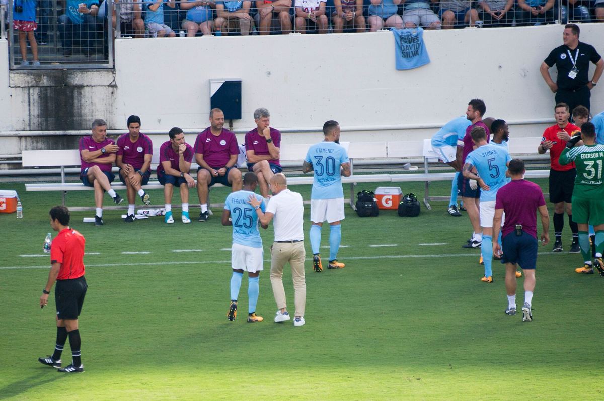 Pep Guardiola on the touchline during a Manchester City match.